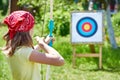 Girl with bow shooting to sport aim Royalty Free Stock Photo