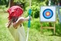 Girl with bow shooting to sport aim Royalty Free Stock Photo