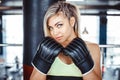 Girl boxer beats the punching bag Royalty Free Stock Photo