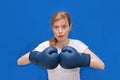 Girl boxer in blue arena