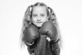 Girl boxer knows how defend herself. Girl child strong with boxing gloves posing on white background. She ready to