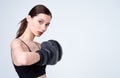 Athletic young white girl in boxing gloves Royalty Free Stock Photo