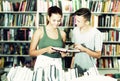 Girl and boy in book store Royalty Free Stock Photo