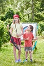 Girl and boy with bow near sport aim Royalty Free Stock Photo