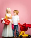 Girl and boy children shopping. Couple kids hold plastic shopping basket toy. Kids store. Mall shopping. Buy products Royalty Free Stock Photo