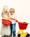 Girl and boy children shopping. Kids store. Couple kids hold plastic shopping basket toy. Buy with discount. Family Royalty Free Stock Photo