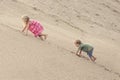 Girl and boy Climbing On The Sand dune. Summer day Royalty Free Stock Photo
