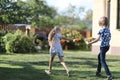 A girl and a boy in a comic battle on water pistols Royalty Free Stock Photo