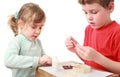 Girl and boy crafts at small table Royalty Free Stock Photo