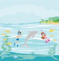 Girl and boy are diving with a dolphin Royalty Free Stock Photo