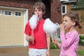 Girl and boy eat cotton candy Royalty Free Stock Photo