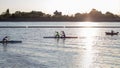 The girl or boy is engaged in rowing sitting in a boat rowing oars in rafting Royalty Free Stock Photo