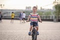 The girl or boy is engaged in rowing sitting in a boat rowing oars in rafting Royalty Free Stock Photo