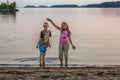 Girl and boy in the evening on the lake Royalty Free Stock Photo