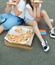 A girl and a boy are looking at big delicious pizza in a box Royalty Free Stock Photo