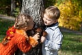 A girl and a boy are playing hide-and-seek Royalty Free Stock Photo