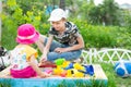 Girl and boy playing in the sandbox Royalty Free Stock Photo