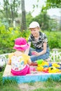 Girl and boy playing in the sandbox Royalty Free Stock Photo