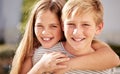 Girl, boy and portrait in family, smile and happy siblings in home backyard, garden and hug together. Kids, brother and