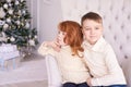 Girl and boy. Small children. Bright interior. Horizontally