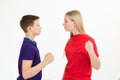 A girl and a boy sort out the relationship with a physical threat, close-up.