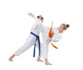 Girl and boy are training attack and defense karate