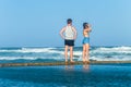 Girl boy watching ocean waves Royalty Free Stock Photo