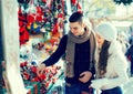 Girl with boyfriend choosing tradition catalan Christmas souven Royalty Free Stock Photo