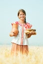 Girl with bread at rye field Royalty Free Stock Photo
