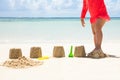 Girl Breaking The Sandcastle With Leg At Beach Royalty Free Stock Photo