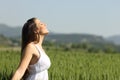 Girl breathing fresh air with white dress