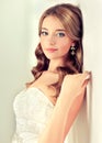 Girl bride in wedding dress with elegant hairstyle. Royalty Free Stock Photo