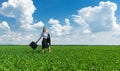 Girl with a briefcase walking on grass Royalty Free Stock Photo