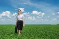 Girl with a briefcase walking on grass Royalty Free Stock Photo