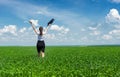 Girl with a briefcase walking on grass Royalty Free Stock Photo