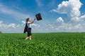 Girl with a briefcase walking on the grass Royalty Free Stock Photo