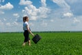Girl with a briefcase walking on the grass Royalty Free Stock Photo