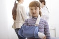 Girl with broken arm and arm brace in the doctor`s office