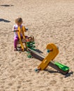 Girl on a broken seesaw