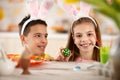 Girl with brother imitates rabbit Royalty Free Stock Photo
