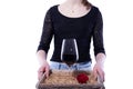 The girl brought a glass of wine and a rose on a tray Royalty Free Stock Photo