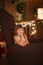 Girl on brown chair , Christmas or New Year concept