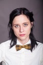 Girl brunette office worker with bow tie Royalty Free Stock Photo