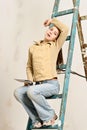 Girl brunette teenager busy repairing an apartment