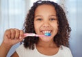 Girl, brush and smile with teeth for dental, care and clean hygiene in fresh oral healthcare at home. Portrait of a Royalty Free Stock Photo