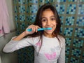 Girl brushing teeth