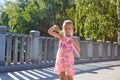 Girl with bubble blower outdoors. Royalty Free Stock Photo
