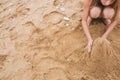 Girl build from the sand on the beach Royalty Free Stock Photo