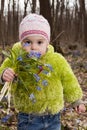A girl with bunch of bluebells in spring forest Royalty Free Stock Photo