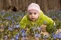 A girl with bunch of bluebells in spring forest Royalty Free Stock Photo